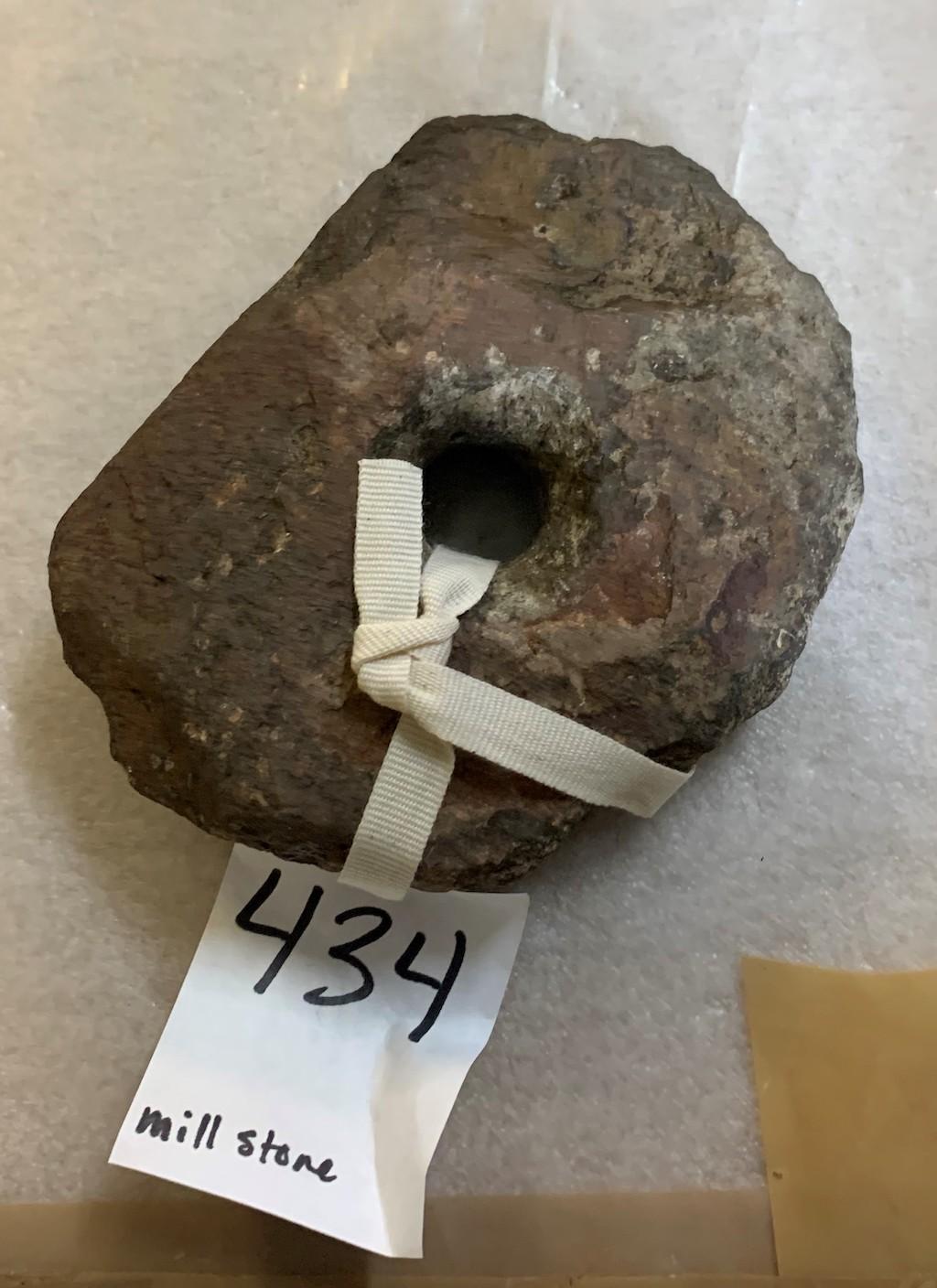 Bored stone previously identified as a ‘mill stone’